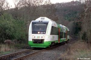 White and green DMU on singletrack.