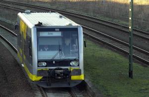 Very small DMU enters a station.