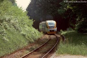 DMU approaches on curvy track through a 
forest.